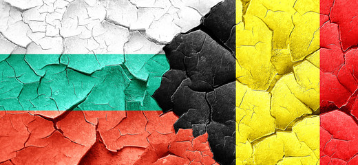 bulgaria flag with Belgium flag on a grunge cracked wall