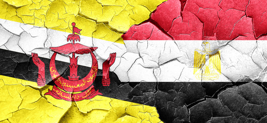 Brunei flag with egypt flag on a grunge cracked wall