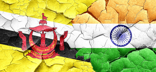 Brunei flag with India flag on a grunge cracked wall