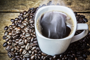 Coffee Cup and Beans on Wooden Table