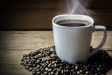 Coffee Cup and Beans on Wooden Table