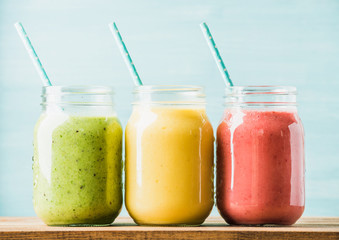 Freshly blended fruit smoothies of various colors and tastes