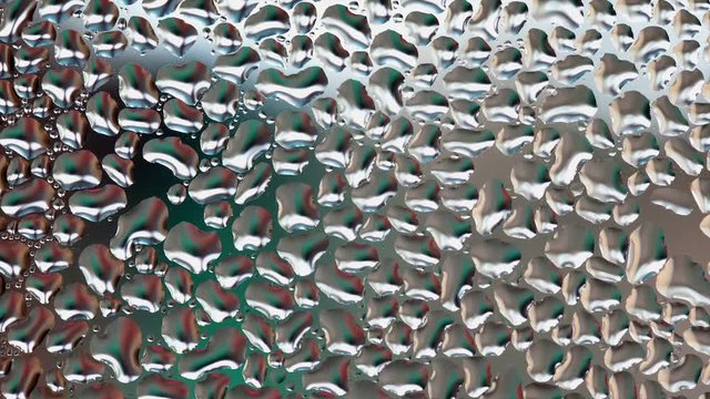 Water drops at transparent surface, panning HD video