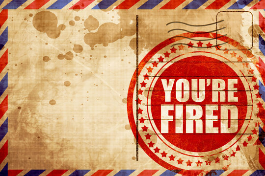 You're Fired, Red Grunge Stamp On An Airmail Background