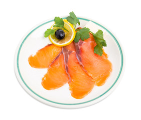 Delicious sliced salmon with lemon.