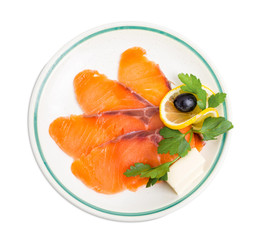 Delicious sliced salmon with lemon.