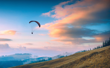 Paraglide in a Carpathian sunset sky