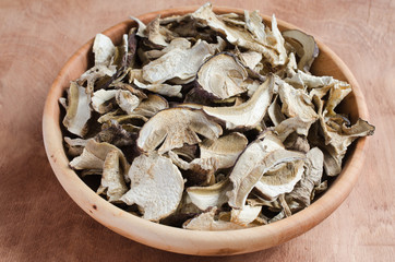 Dried porcini mushrooms on a wooden table. Rustic style.