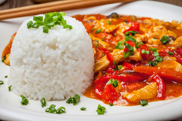 Chinese chicken with vegetables and rice.