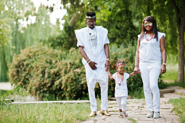 Naklejka na ściany i meble African american rich family at white nigerian national clothing
