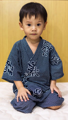 Cute asian boy in kimono dres