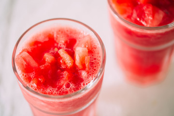 watermelon smoothie on white background.  selective focus