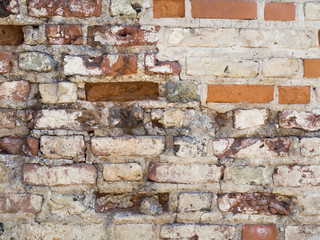 Vintage red brick wall with sprinkled white plaster texture background