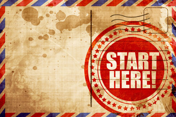 Fototapeta premium start here!, red grunge stamp on an airmail background