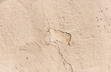 Grungy and textured stone wall background. Weathered and old building exterior backdrop.