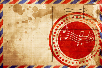 Music note background, red grunge stamp on an airmail background