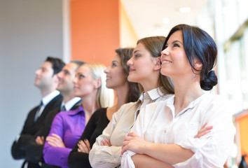 Obraz premium Portrait of a group of colleagues cheering together in an office