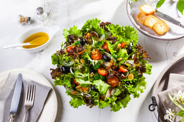 Fresh summer salad on a garden table