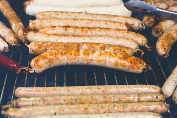 Street fast food, grilled sausages at bbq