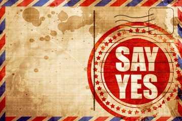Fototapeta premium say yes, red grunge stamp on an airmail background