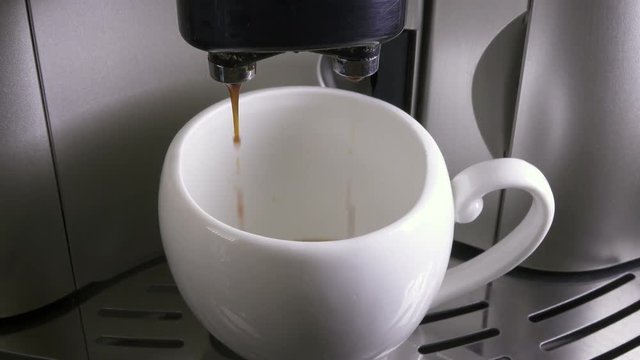 Coffee flows in a cup
