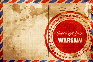 Greetings from warsaw, red grunge stamp on an airmail background