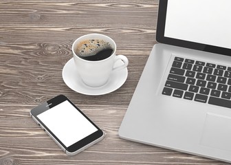 Laptop smartphone and coffee cup on wood. 3d rendering.