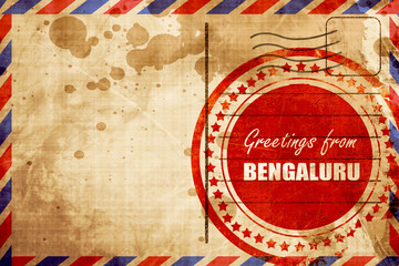 Greetings from bengaluru, red grunge stamp on an airmail backgro