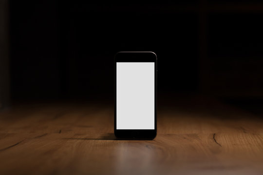 Mobile Smart Phone With Blank Screen On The Table