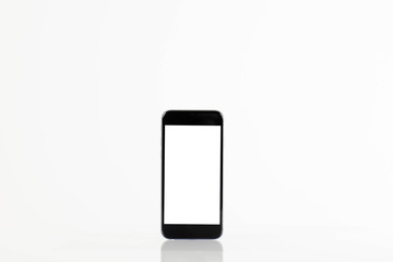 Standing mobile smart phone with blank screen on white background