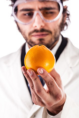 scientist looking at an orange