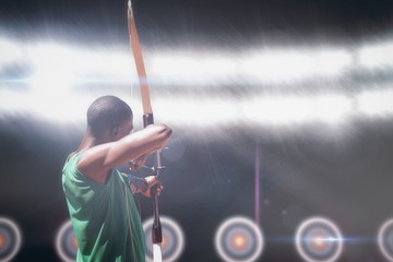 Composite image of sportsman doing archery
