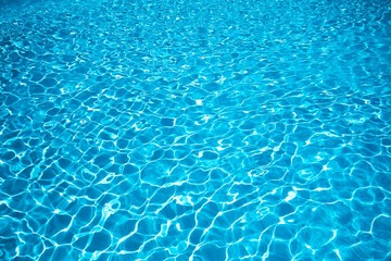 Fototapeta na wymiar Blue water surface, Ripple Water in swimming pool with sun reflection