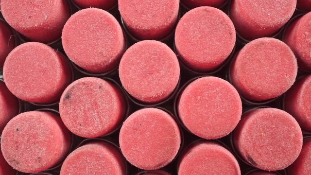 Numerous pink pencil erasers macro dolly shot