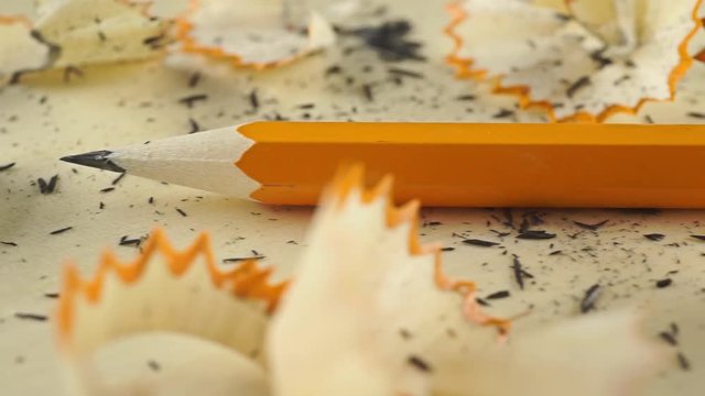 Extreme close up dolly shot of sharpener and pencil with eraser