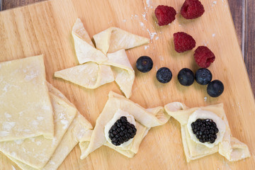 Cut pastry into pinwheel shape and various other shapes.