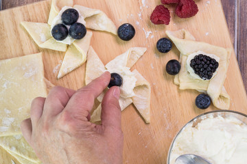 Cut pastry into pinwheel shape and various other shapes.