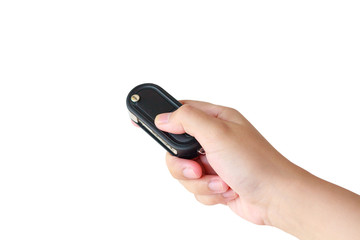 women hand presses on the remote control car key alarm systems