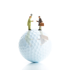 ゴルフボールとビジネスマン