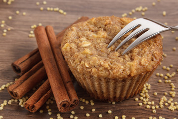 Fresh muffin with millet groats, cinnamon and apple baked with wholemeal flour, delicious healthy dessert