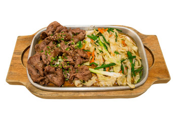 Beef with vegetables on hot plate