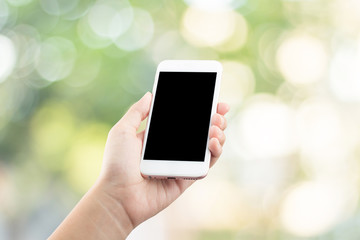 Female hand using mobile smartphone blurred background - mockup