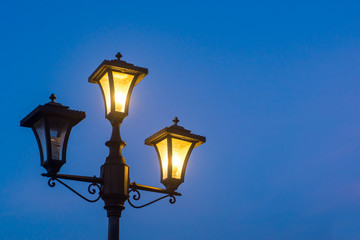 Fototapeta na wymiar Vintage lamppost at night, isolated.