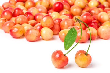 cherries with leaf closeup isolated on white background