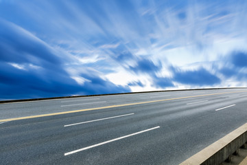 Fototapeta premium The new asphalt highway is under the blue sky