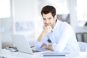 Successful professional man working at office