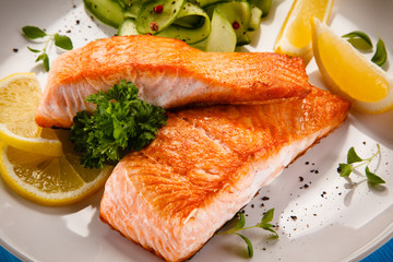 Grilled salmon steaks and vegetables