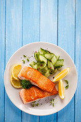 Grilled salmon steaks and vegetables