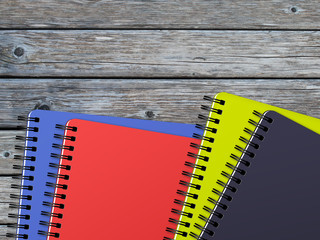 Note book on wooden background