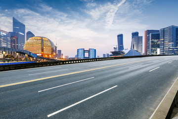 Fototapeta premium Asphalt roads and beautiful scenery of the city at night in Hangzhou